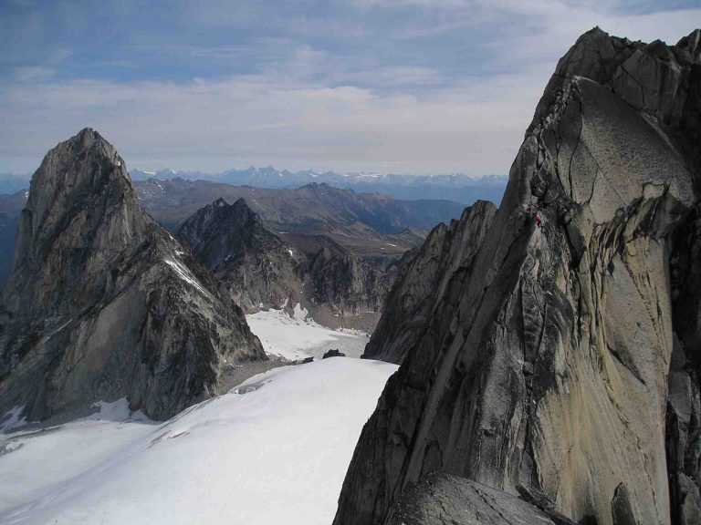 Climbers on the West Ridge of Pigeon Spire,  Bugaboo Spire in the distance